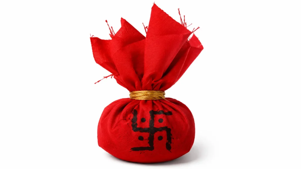 The Benefits one accrues when one observes a Navaratri Vrat. red cloth potli with auspicious swastika symbol
